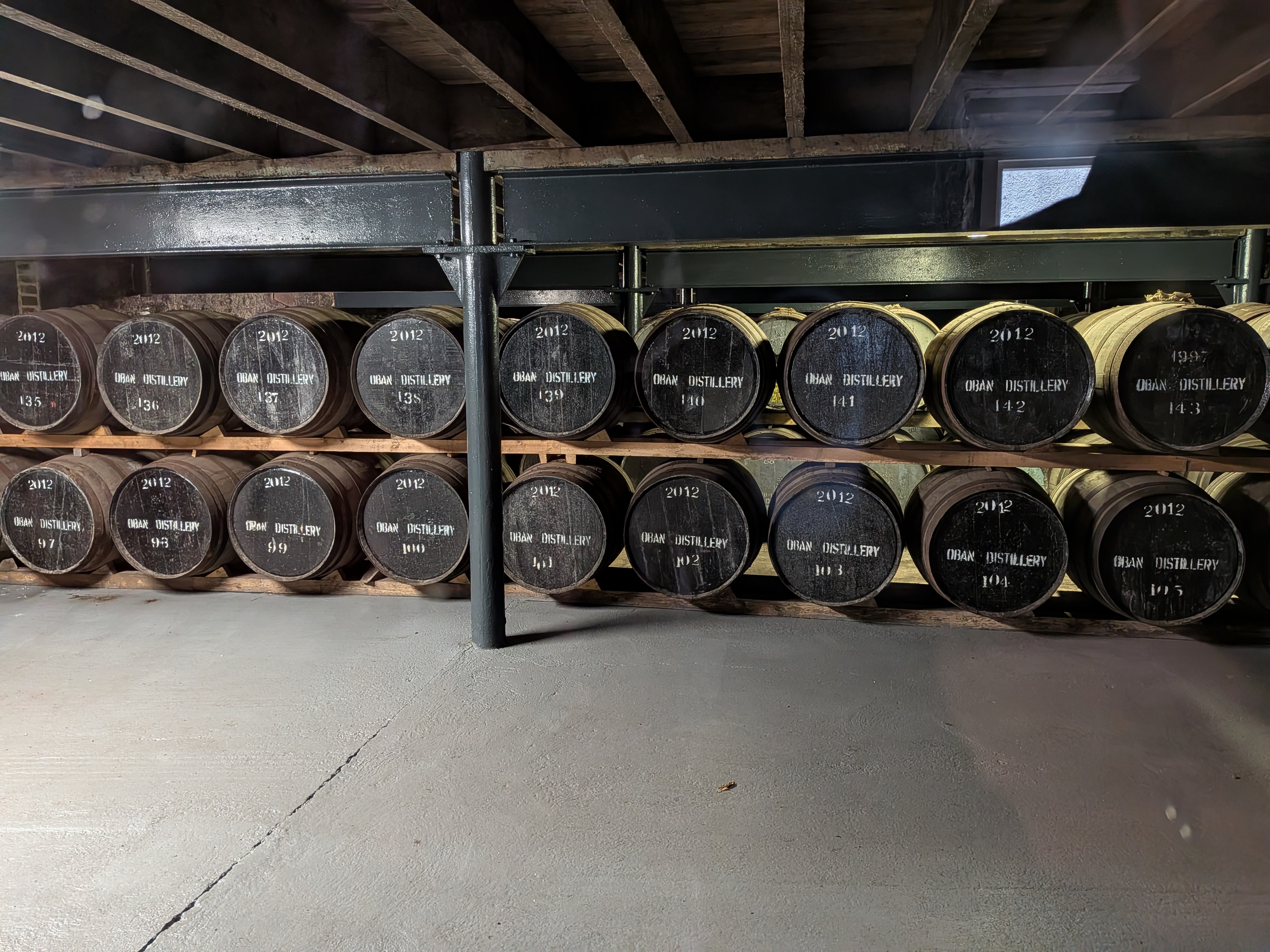 Barrels of Scotch in a warehouse at the Oban Distillery